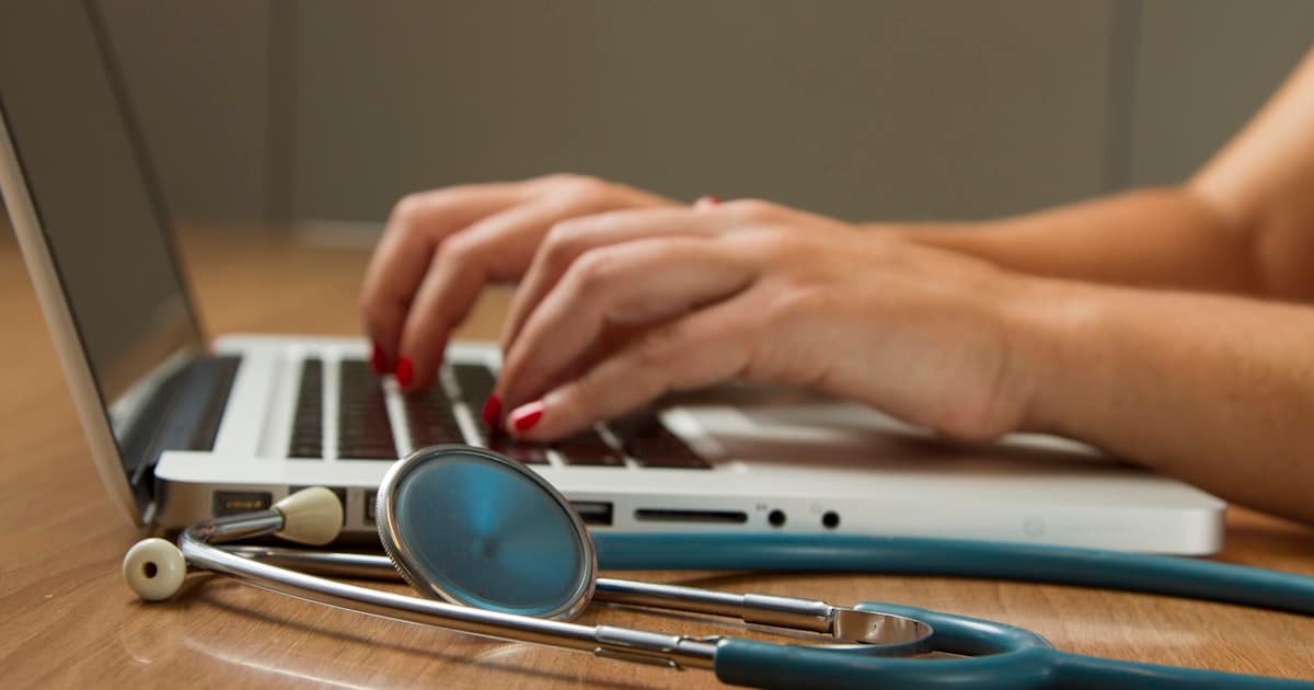 A doctor with stethoscope representing health insurance in Germany